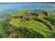 A view of the structure on the property and its beautiful grass at 9269 Silver Lake Dr, Leesburg, FL 34788