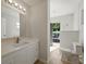 Bathroom featuring a modern vanity and hexagonal tile accents at 9269 Silver Lake Dr, Leesburg, FL 34788