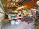 Spacious garage with high ceilings offers potential for workshop or storage space at 9269 Silver Lake Dr, Leesburg, FL 34788