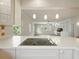 Beautiful kitchen with eat-in island area overlooks the living room, creating an open-concept living space at 9269 Silver Lake Dr, Leesburg, FL 34788