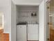 Laundry closet featuring a washer and dryer at 9269 Silver Lake Dr, Leesburg, FL 34788