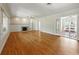 Spacious living room boasting hardwood floors, a fireplace, and french doors at 9269 Silver Lake Dr, Leesburg, FL 34788