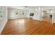 Bright living room features hardwood floors, built-in shelving, and natural light from large windows at 9269 Silver Lake Dr, Leesburg, FL 34788