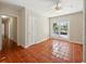 Open living room with tile flooring and patio access at 9269 Silver Lake Dr, Leesburg, FL 34788