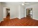 Bright living room with tile flooring, hallway and entry door view at 9269 Silver Lake Dr, Leesburg, FL 34788