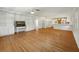 Spacious living room features hardwood floors, built-in shelving, and seamless flow into the modern kitchen at 9269 Silver Lake Dr, Leesburg, FL 34788