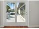 Patio view through glass paneled doors at 9269 Silver Lake Dr, Leesburg, FL 34788