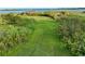 Expansive lawn leading to waterfront, showcasing natural beauty and space for outdoor enjoyment at 9269 Silver Lake Dr, Leesburg, FL 34788