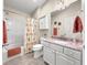 Bathroom featuring a granite countertop vanity, decorative seashell shower curtain and tiled floors at 992 Davit Pl, The Villages, FL 32162
