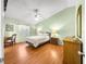 Relaxing bedroom with vaulted ceiling, comfortable bed, and writing desk at 992 Davit Pl, The Villages, FL 32162