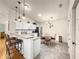 Charming kitchen with granite counters, stainless appliances, and eat-in area at 992 Davit Pl, The Villages, FL 32162