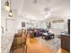 Spacious living area with hardwood floors, ceiling fan, and comfortable furnishings at 992 Davit Pl, The Villages, FL 32162