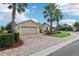 Inviting single-story home boasts a brick driveway, meticulous landscaping, and a convenient two-car garage at 10046 Ketch Kay Ln, Oxford, FL 34484