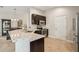 Contemporary kitchen with granite counters, stainless steel appliances, and dark wood cabinets at 10046 Ketch Kay Ln, Oxford, FL 34484
