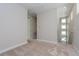 Upstairs hallway with neutral carpet, leading to various rooms and a view of the staircase at 10302 Pearson Ave, Orlando, FL 32827