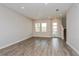 Spacious living room with luxury vinyl plank flooring, recessed lighting, and a modern entryway at 10302 Pearson Ave, Orlando, FL 32827