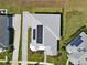 Aerial view of house with solar panels, long drive way and beautiful landscaping at 1042 Sugarloaf Key Loop, Lady Lake, FL 32159