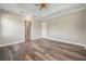 This spacious bedroom offers wood flooring, recessed lighting and access to an en suite bathroom at 1042 Sugarloaf Key Loop, Lady Lake, FL 32159