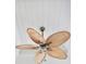 Ceiling fan with unique, palm-leaf inspired blades adds a tropical flair at 1042 Sugarloaf Key Loop, Lady Lake, FL 32159