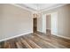 Dining room showing wood floors, sliding doors, and views into the next room at 1042 Sugarloaf Key Loop, Lady Lake, FL 32159