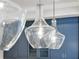 Elegant kitchen island pendant lighting adds ambiance to the modern cooking space at 1042 Sugarloaf Key Loop, Lady Lake, FL 32159