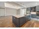 Kitchen island with blue cabinets, white countertops, stainless appliances, and pendant lighting, ideal for Gathering gatherings at 1042 Sugarloaf Key Loop, Lady Lake, FL 32159