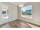 Room showcasing natural light, wood floors and outdoor view at 1042 Sugarloaf Key Loop, Lady Lake, FL 32159