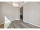 Image of a room with wood flooring, neutral paint, and ceiling lighting at 1042 Sugarloaf Key Loop, Lady Lake, FL 32159