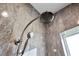 Modern shower with sleek fixtures and contemporary design; it features a hand held sprayer and rainfall shower head at 1042 Sugarloaf Key Loop, Lady Lake, FL 32159