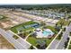 Community aerial view showcasing the pool, tennis courts and future development at 1057 Sugarloaf Key Loop, Lady Lake, FL 32159