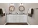 Modern bathroom with double vanity, granite countertops, and wooden framed mirrors at 1057 Sugarloaf Key Loop, Lady Lake, FL 32159