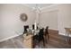 Dining room featuring a modern chandelier, a modern table with seating for six, and dark wood flooring at 1057 Sugarloaf Key Loop, Lady Lake, FL 32159