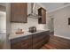 Gourmet kitchen features granite countertops, stainless steel appliances, and custom backsplash at 1057 Sugarloaf Key Loop, Lady Lake, FL 32159
