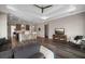 Cozy living room area with hardwood floors that flows into an open concept kitchen design at 1057 Sugarloaf Key Loop, Lady Lake, FL 32159