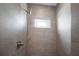 Modern tiled shower with a sleek showerhead and window at 1057 Sugarloaf Key Loop, Lady Lake, FL 32159
