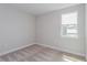 Neutral bedroom with a single window and neutral carpet at 1065 Peebles St, Orlando, FL 32827