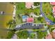 Expansive aerial view of home showing waterfront location, boat dock, and pool at 112 Waterwood Dr, Yalaha, FL 34797