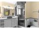 Bathroom featuring glass enclosed shower, modern fixtures, and tile accents at 112 Waterwood Dr, Yalaha, FL 34797