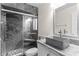 Stylish bathroom featuring a walk-in shower with gray tiling and modern sink at 112 Waterwood Dr, Yalaha, FL 34797