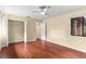 Bedroom with wood flooring, a ceiling fan, closet with folding doors, and a window at 112 Waterwood Dr, Yalaha, FL 34797