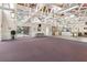 Large clubhouse featuring a kitchenette and a mix of carpeted and hardwood floors at 112 Waterwood Dr, Yalaha, FL 34797