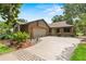 Attractive brick home with a two-car garage, landscaping and a wide driveway at 112 Waterwood Dr, Yalaha, FL 34797