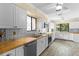 Bright kitchen features stainless steel appliances, and beautiful wood countertops at 112 Waterwood Dr, Yalaha, FL 34797