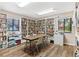 Cozy library with floor to ceiling bookshelves and a table for reading or games at 112 Waterwood Dr, Yalaha, FL 34797