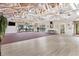 Spacious recreation room featuring wood beam ceiling, access to pool, and lots of open space at 112 Waterwood Dr, Yalaha, FL 34797
