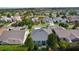 An aerial view of a home featuring a modern roof and verdant landscaping at 1122 Magrath Way, The Villages, FL 32162