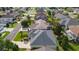 Bird's eye view of a lovely home nestled in a quiet community with well-manicured lawns and mature trees at 1122 Magrath Way, The Villages, FL 32162
