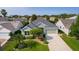 Charming single-story home with a well-manicured lawn and mature landscaping at 1122 Magrath Way, The Villages, FL 32162