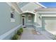 Welcoming front entrance with decorative accents and manicured landscaping, creating great curb appeal at 1122 Magrath Way, The Villages, FL 32162