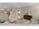 Inviting living area with hardwood floors, neutral decor, and an open layout at 1122 Magrath Way, The Villages, FL 32162